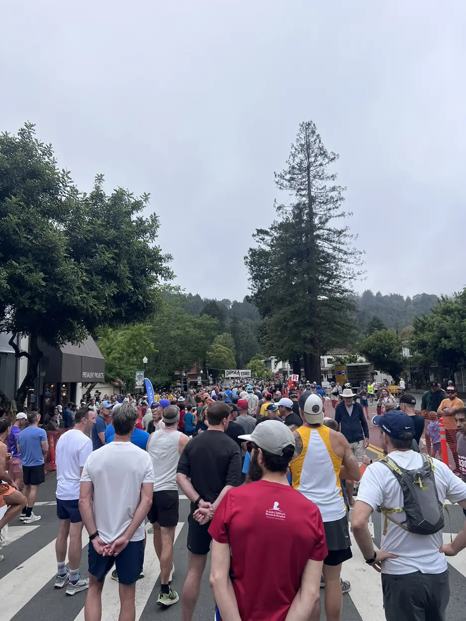 Wide view of runners gathered in downtown Mill Valley before the Dipsea Race